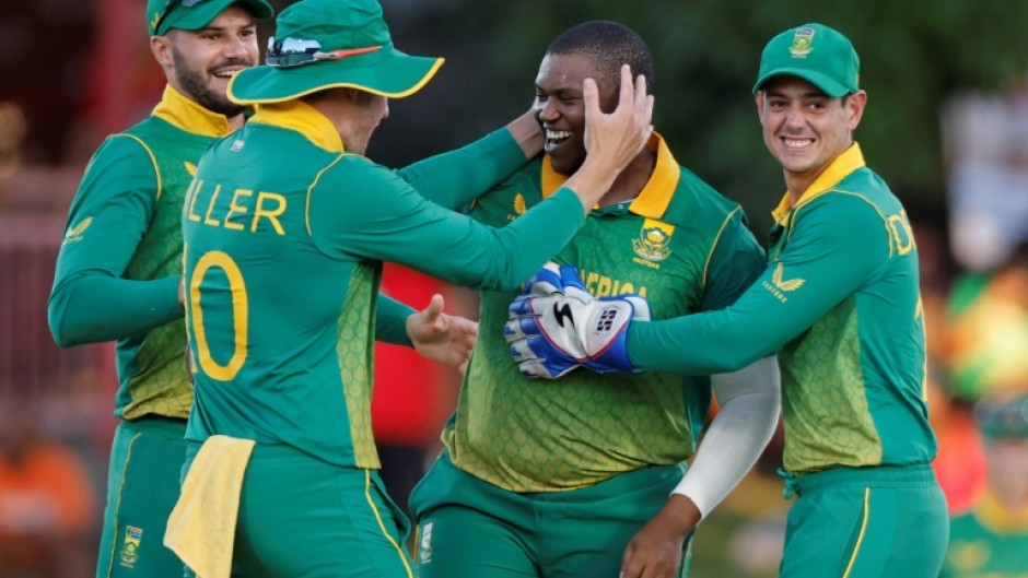 Man of the match: South Africa's Sisanda Magala is congratulated by teammates after the dismissal of England's Harry Brook 