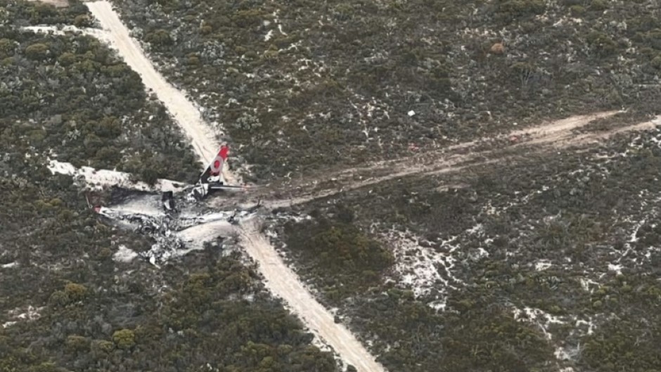 Two pilots made a 'miraculous' escape after their Boeing 737 water-bombing plane crashed and burned while fighting a blaze in remote Western Australia