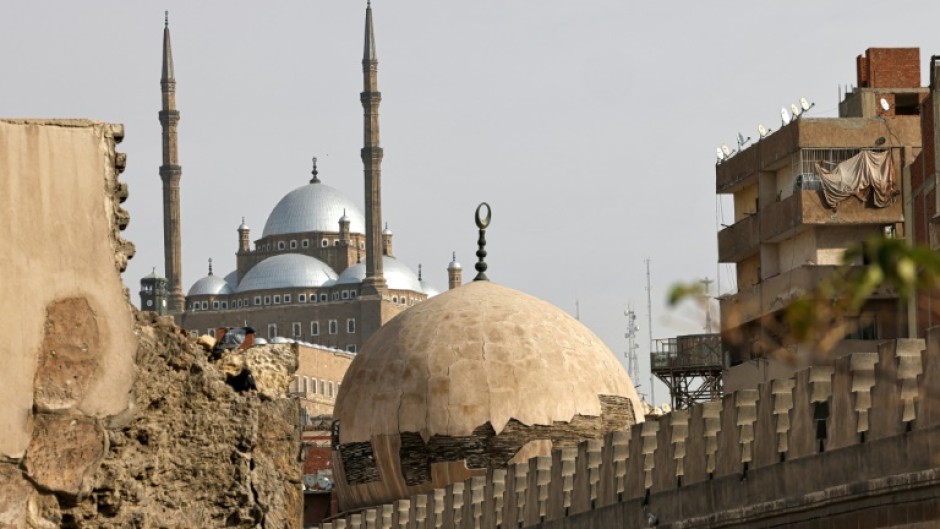 Cairo's iconic domes and minarets are embedded into the labyrinthine alleys of tight-knit working-class neighbourhoods