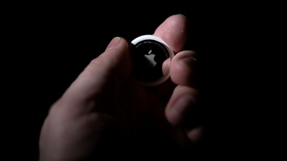 Apple's AirTag is a silver and white gadget about the size of a coin