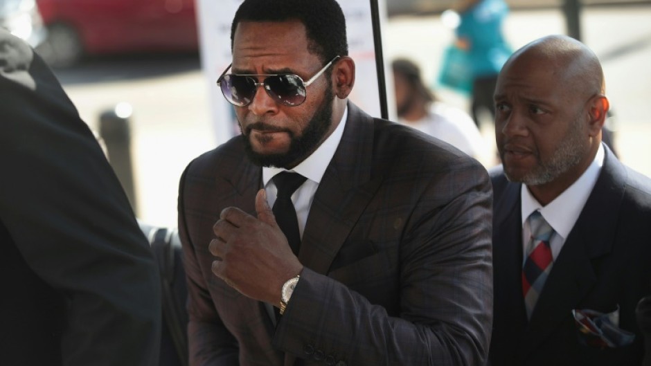 R&B singer R. Kelly, shown here attending a hearing in 2019, was sentenced to 20 years for child sex crimes he was convicted of in Chicago -- he will serve an extra year in prison on top of an earlier 30-year sentence