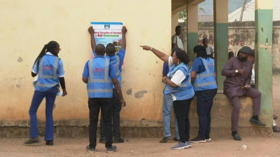 Electoral officials prepare to open a polling station