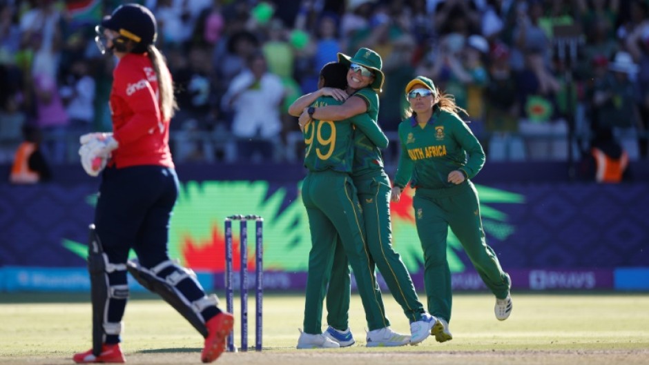 On our way: South Africa's Ayabonga Khaka (2nd left) celebrates after the dismissal of England's Sophie Ecclestone 