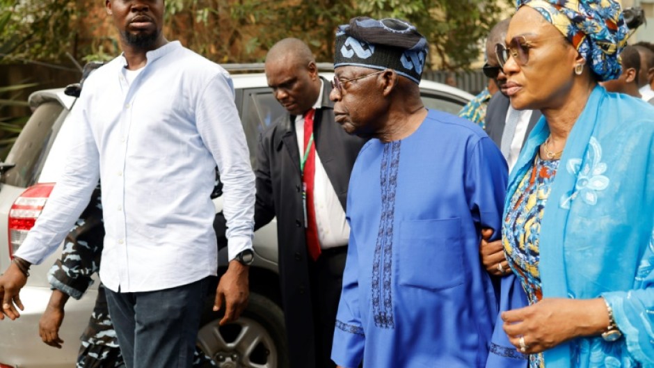 Bola Tinubu, on his way to vote with wife, has spent years building his Lagos powerbase into a nationwide network of contacts