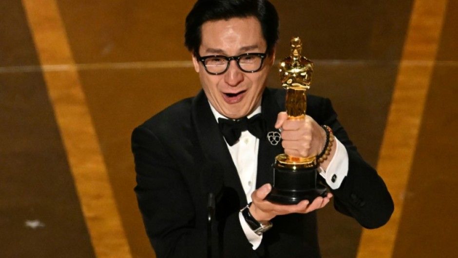 Ke Huy Quan accepts the Oscar for best supporting actor for "Everything Everywhere All at Once" 