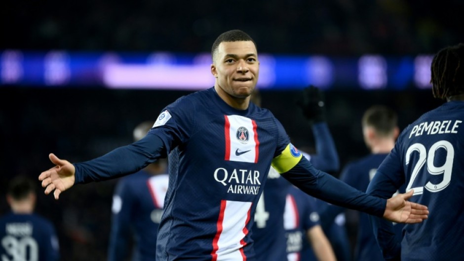 Kylian Mbappe celebrates after netting his 201st goal for PSG against Nantes to become the club's all-time top scorer