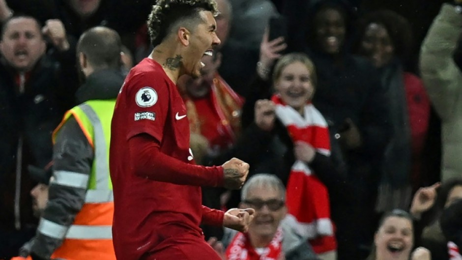 Rout: Roberto Firmino scores the final goal of Liverpool's 7-0 thrashing of Manchester United