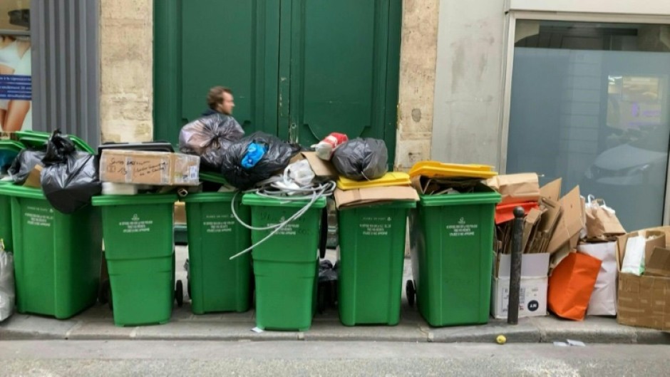 Bins overflow in Paris as workers strike over pension reform 