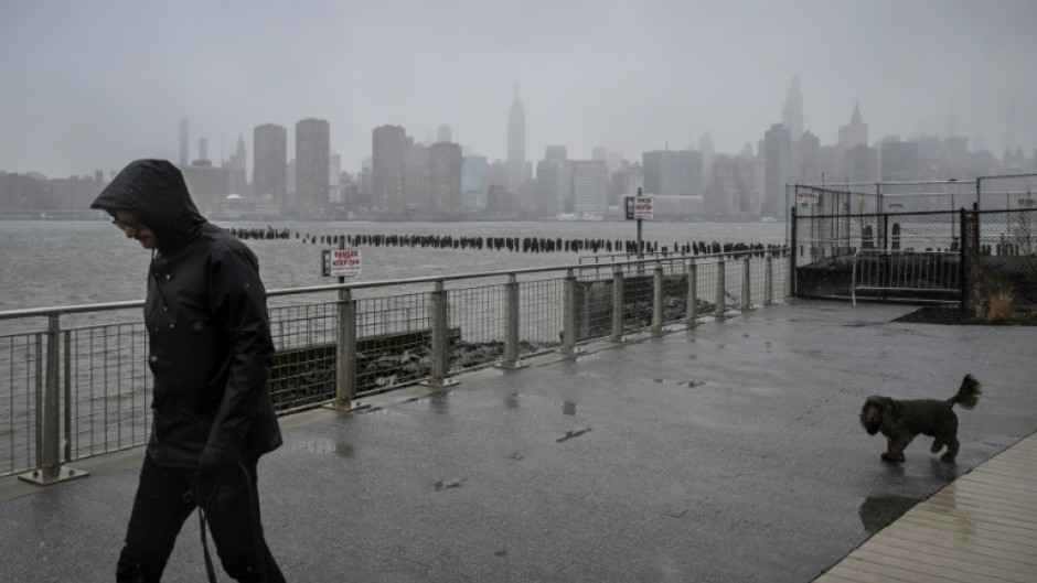 Rain and snow pummeled New York City as a storm gripped the US East Coast