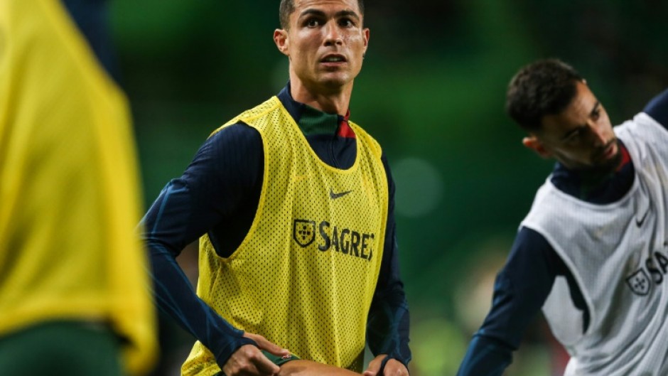 Record-breaker: Cristiano Ronaldo warms up ahead of the match between Portugal and Liechtenstein