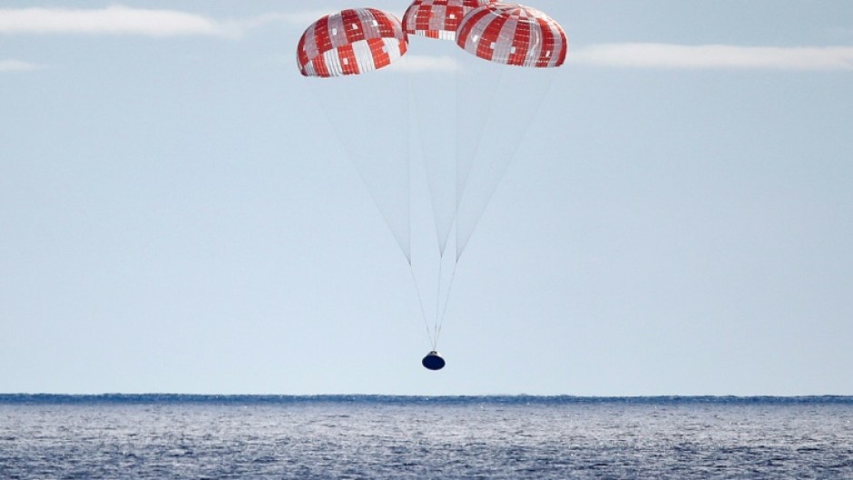 NASA's Orion space capsule splashes down in the Pacific after an uncrewed mission around the Moon