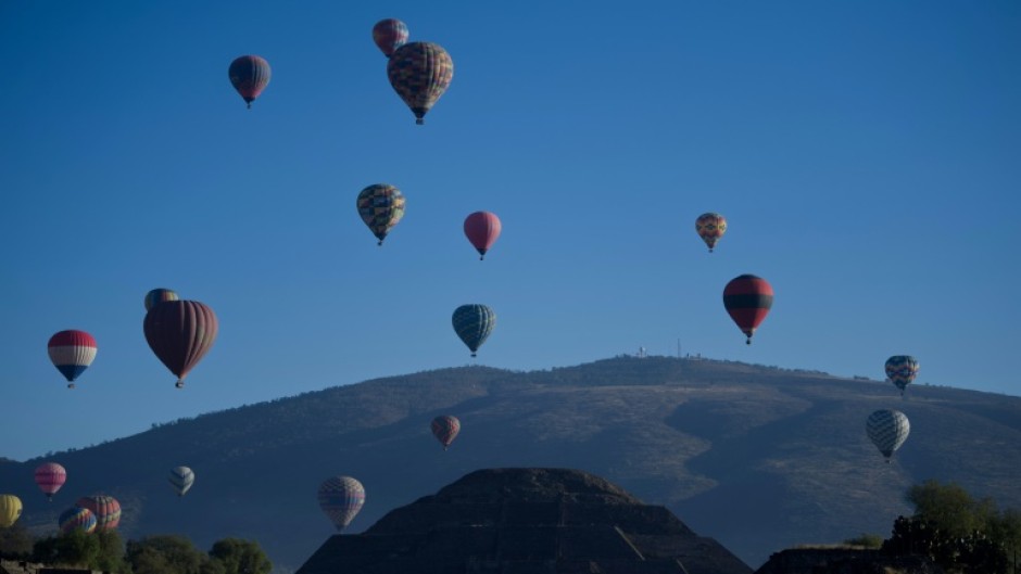 Hot-air balloons are seen flying over the Teotihuacan archeological site, not far from Mexico City, in March 2023