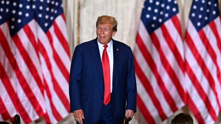 Trump waved to supporters as he arrived at his New York residence on the eve of the historic court hearing