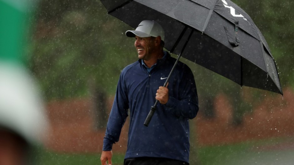 Brooks Koepka held a four-stroke lead at the Masters before rain stopped third-round play on Saturday