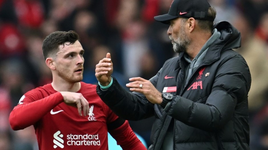 Liverpool defender Andrew Robertson talks to Reds boss Jurgen Klopp