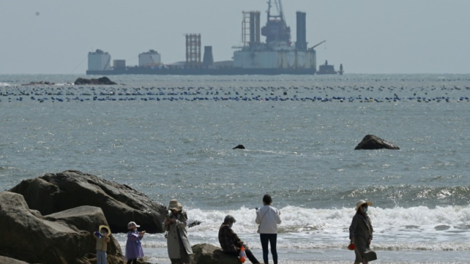 Tourists on Sunday were wandering the beaches of Pingtan, where live-fire exercises were slated for the following day