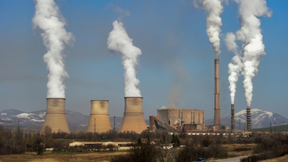 The EU is broadening an emissions trading scheme to more industries and lowering quotas of allowable polluting gases