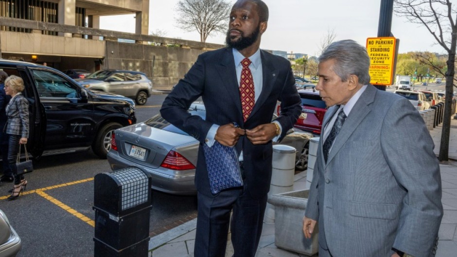 Pras Michel (L), a member of the 1990's hip-hop group the Fugees, was found guilty of multiple counts including illegal campaign contributions and money laundering for his dealings with fugitive Malaysia financier Low Taek Jho