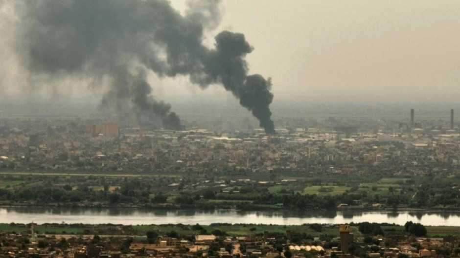 Aerial view of smoke billowing from Khartoum skyline