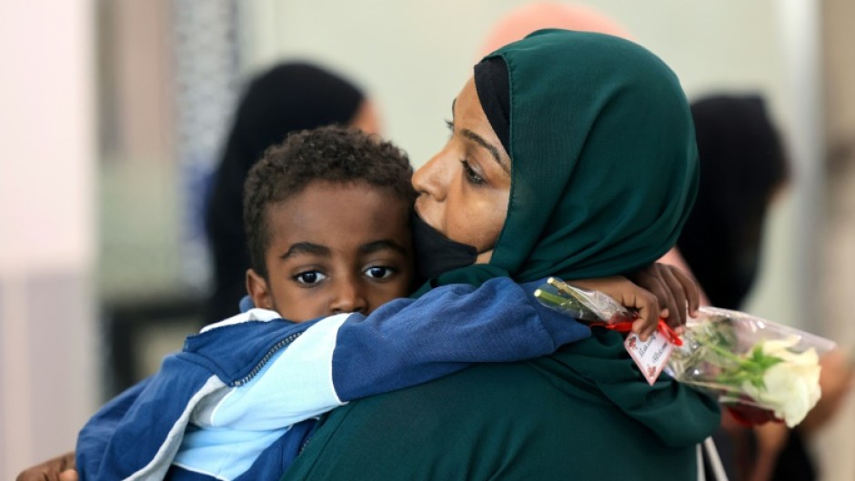 A ferry transporting about 1,900 people arrives at Saudi Arabia's King Faisal Naval base in Jeddah after crossing the Red Sea from Port Sudan with people who fled the fighting