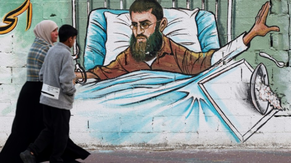 A mural in Gaza City depicts Khader Adnan, who died Tuesday May 2, 2023 in Israeli custody after nearly three months on hunger strike