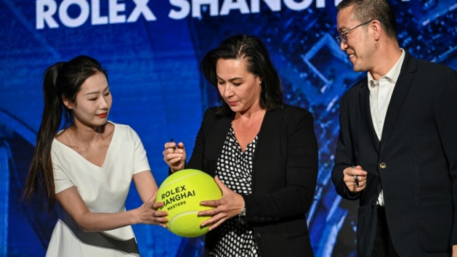 Officials sign an oversized tennis ball at a launch ceremony for the 2023 Shanghai Masters tournament