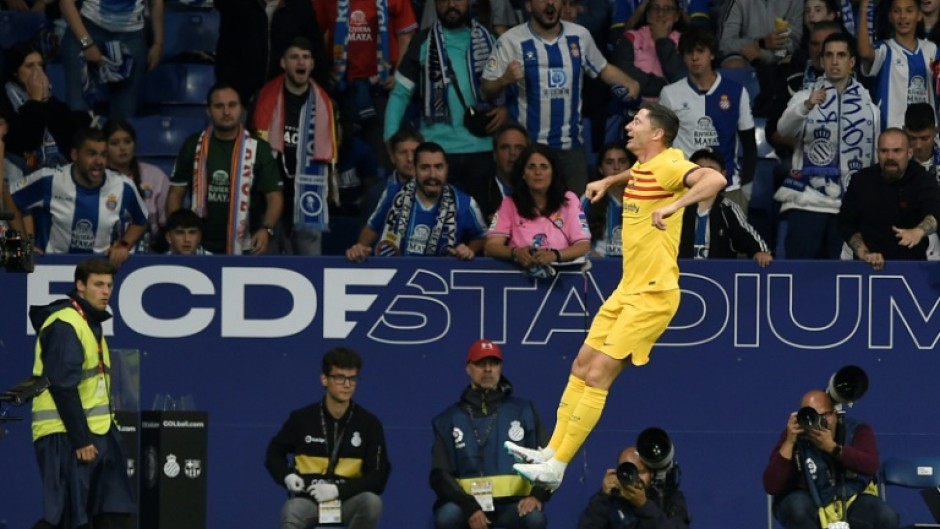 Barcelona's Polish forward Robert Lewandowski celebrates scoring the opening goal against Espanyol as his side won La Liga