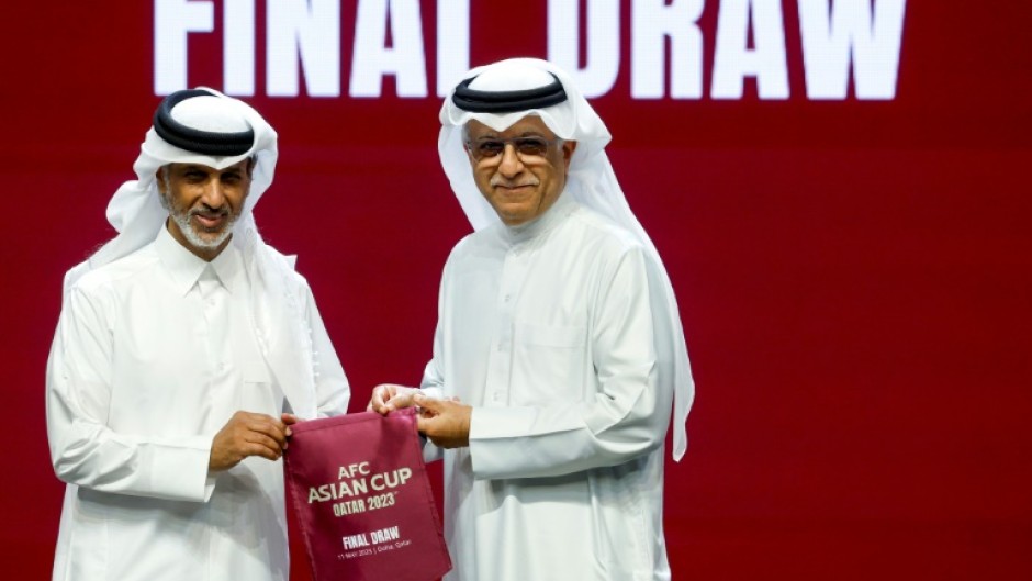 Qatar Football Association president Sheikh Hamad Bin Khalifa Bin Ahmed al-Thani (L) and president of the Asian Football Confederation (AFC) Sheikh Salman bin Ibrahim al-Khalifa at the draw for the AFC Asian Cup