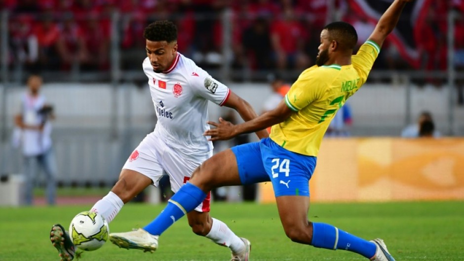 Wydad Casablanca defender Ayoub el Amloud (L) and Mamelodi Sundowns midfielder Sipho Mbule clash during a CAF Champions League semi-final first leg in Morocco.