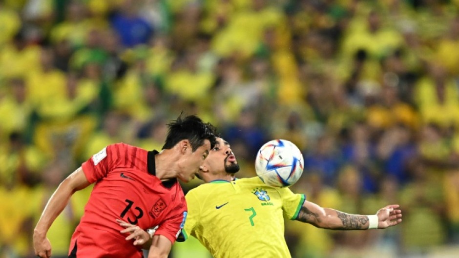 South Korean midfielder Son Jun-ho (L) in action against Brazil at the World Cup