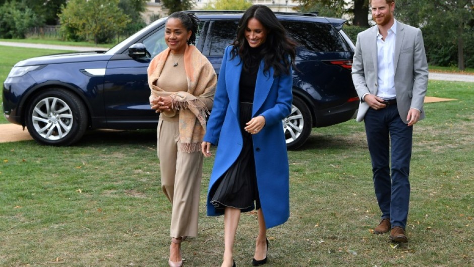 Prince Harry photographed with his wife Meghan and her mother Doria Ragland