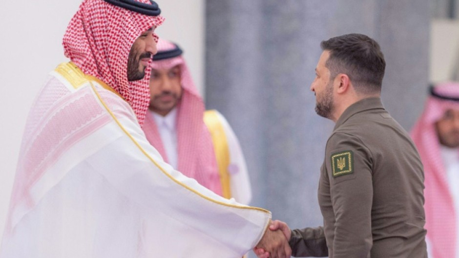 Saudi Crown Prince Mohammed bin Salman welcomes Ukraine's President Volodymyr Zelensky during the Arab League Summit in Jeddah