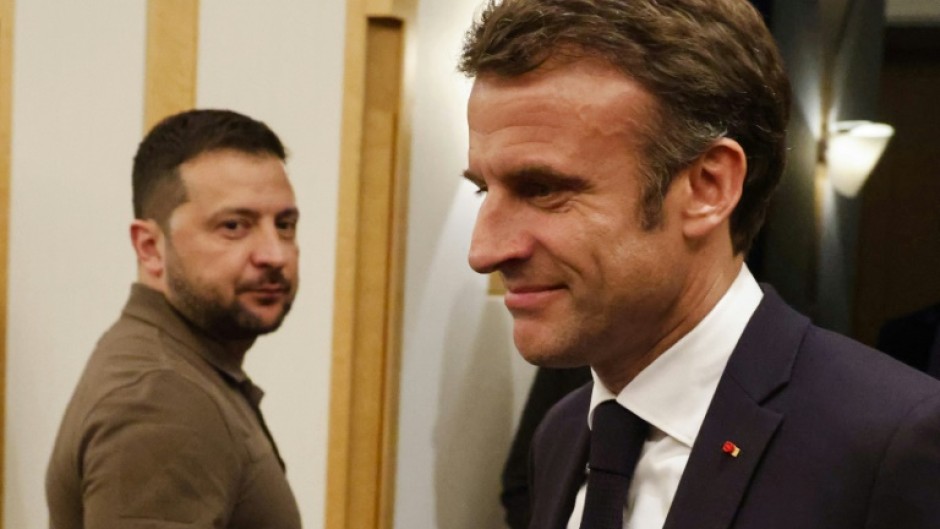 Ukraine's President Volodymyr Zelensky (L) meets France's President Emmanuel Macron on the sidelines of the G7 Leaders' Summit in Hiroshima 