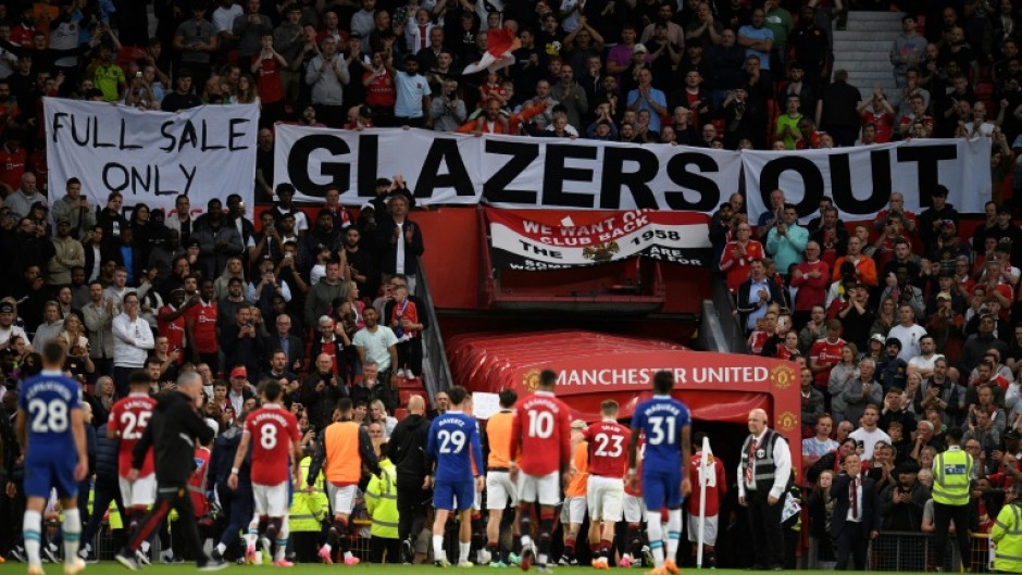 Manchester United fans displayed "Glazers out" banners as they secured a return to Champions League football next season