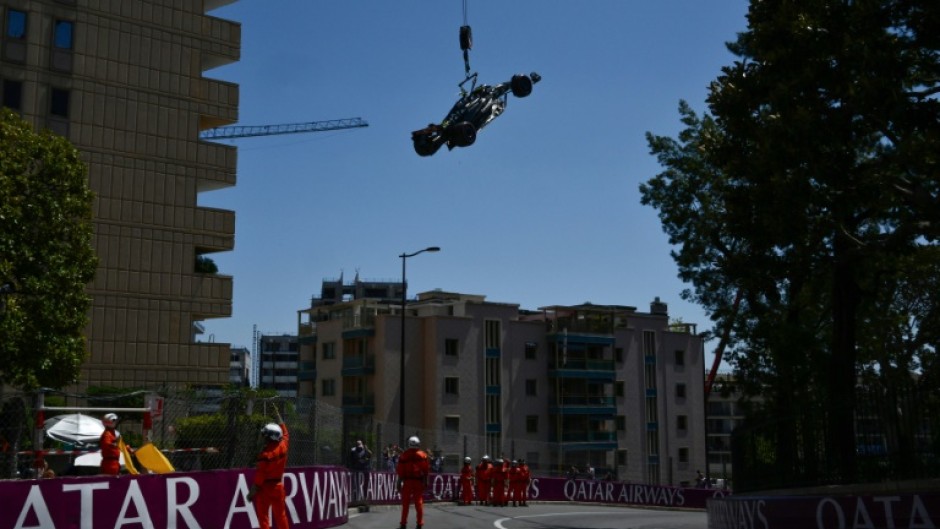 Race marshals remove the car of Mercedes' British driver Lewis Hamilton after he crashed during practice ahead of the Monaco Grand Prix