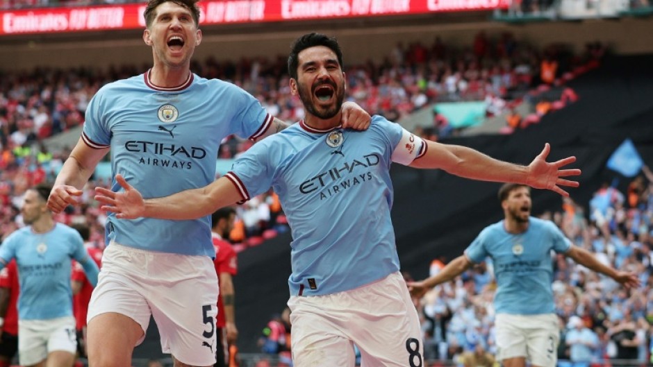 Two good: Ilkay Gundogan (right) scored twice to win the FA Cup for Manchester City