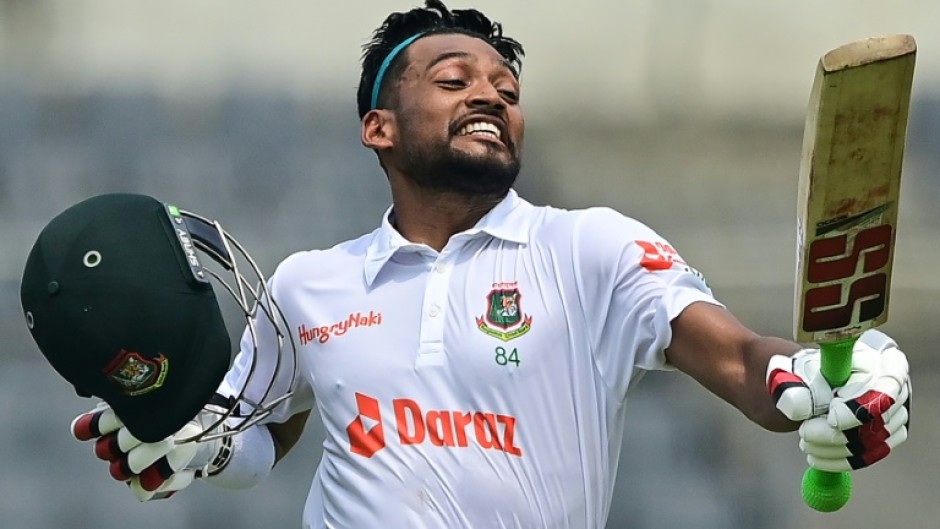 Bangladesh batter Najmul Hossain celebrates after scoring a century on the first day of the one-off Test against Afghanistan at the Sher-e-Bangla National Cricket Stadium in Dhaka