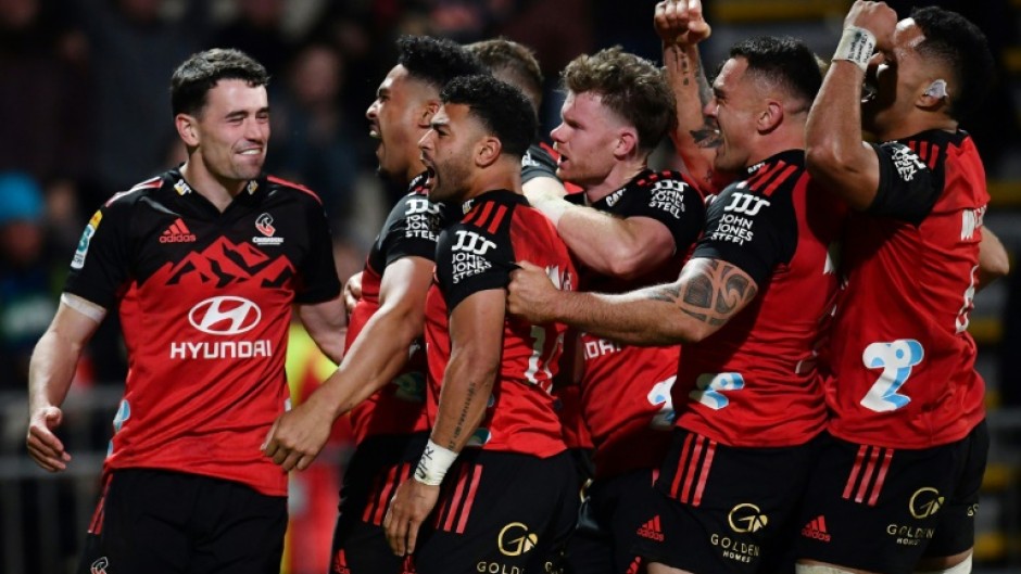 The Crusaders celebrate after a try by Leicester Fainga'anuku (second from left) in Friday's Super Rugby Pacific semi-final win over the Blues