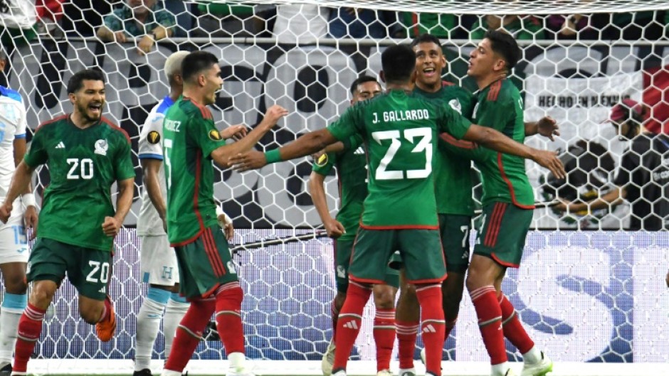 Luis Romo celebrates his second goal as Mexico crushed Honduras 4-0 in the CONCACAF Gold Cup group B in Houston on Sunday