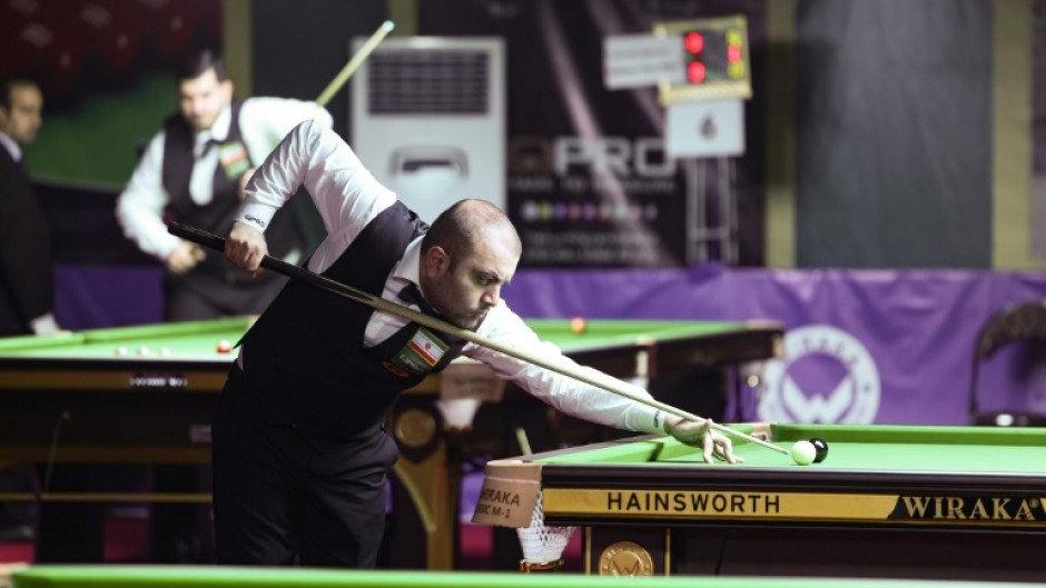 Iranian snooker player Amir Sarkhosh competes during the ACBS Asian 6 Reds Snooker Championship in Tehran on June 24, 2023