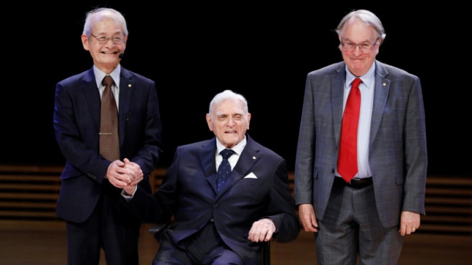 John Goodenough (C) shared the 2019 Nobel Prize in Chemistry for developing the lithium-ion battery with Akira Yoshino (L) and Stanley Whittingham