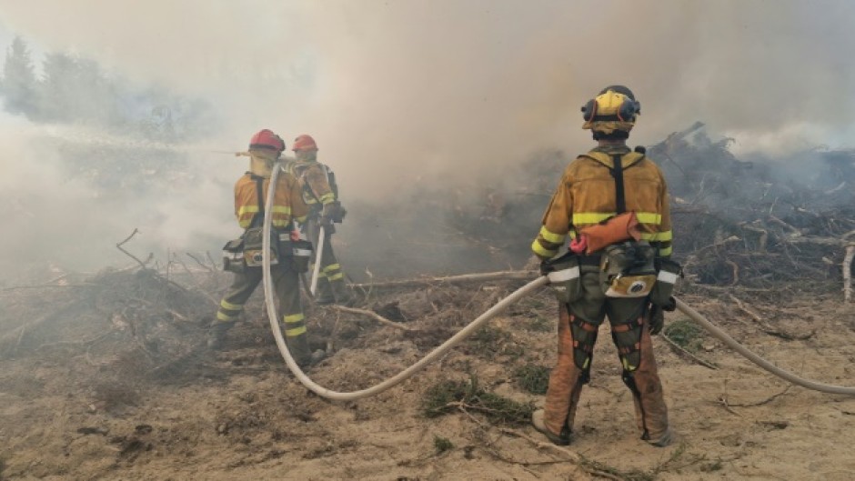 Spanish firefighters battling fires near the Riviere Boisvert, northern Quebec, in Canada in June 2023. 