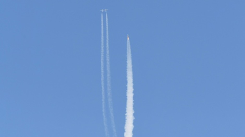 The Virgin Galactic SpaceShipTwo space plane Unity and mothership separate as they fly way above Spaceport America in New Mexico on July 11, 2021