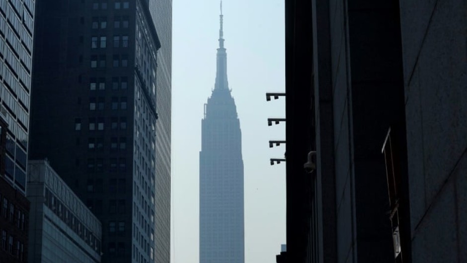 The Empire State Building in New York seen through smoke