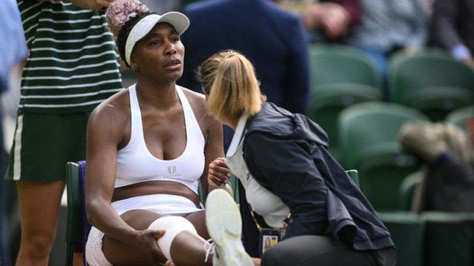 Venus Williams receives medical attention during her Wimbledon first-round match against Ukraine's Elina Svitolina 