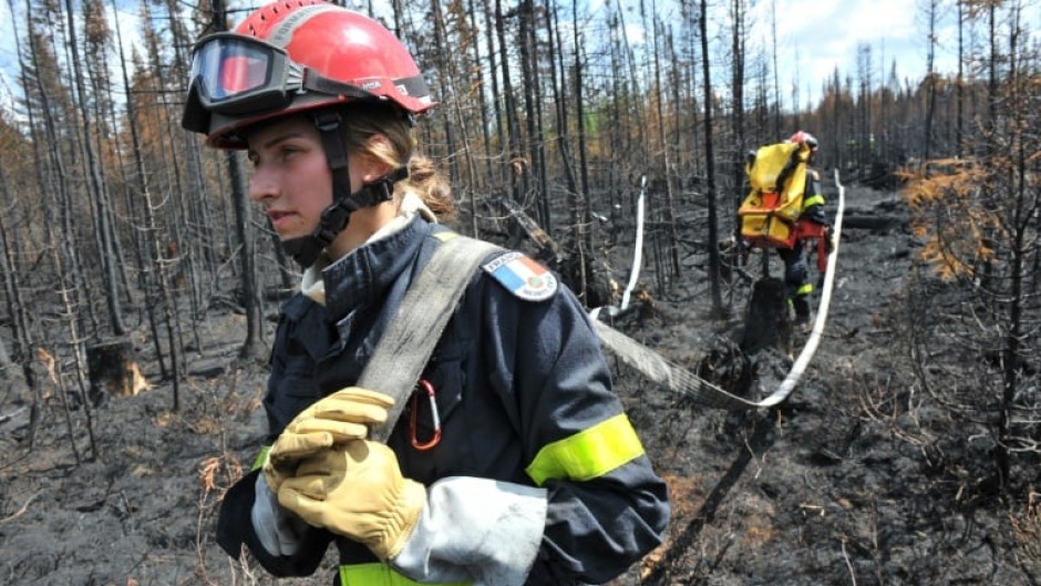 French firefighters battle wildfires in the Abitibi-Temiscamingue region of Canada's Quebec province, in an image released July 3, 2023