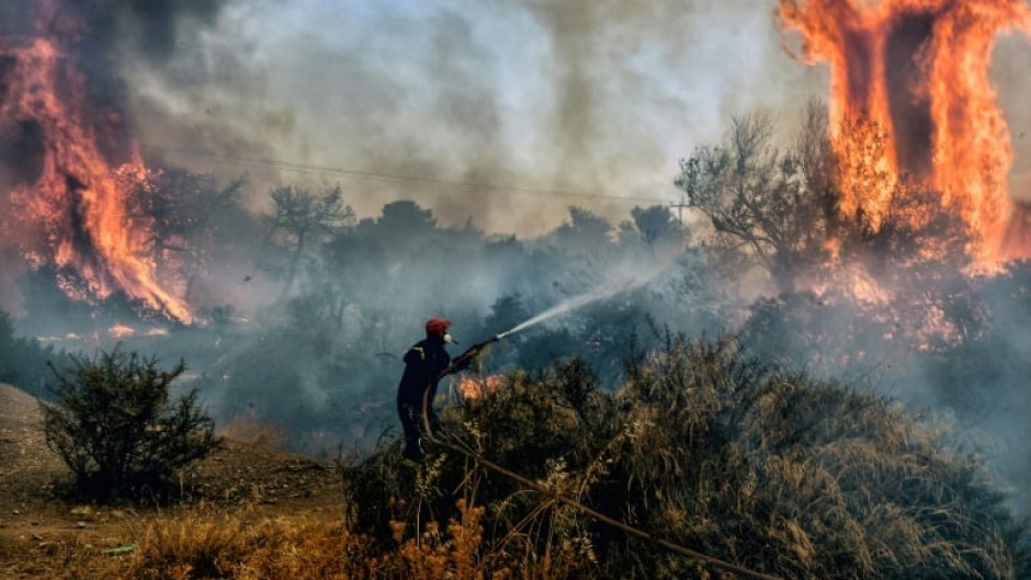 As Greece announced the restrictions, firefighters were still battling wildfires west of Athens