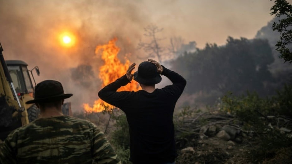 Wildfires have been raging in Greece amid scorching temperatures, forcing mass evacuations in several tourist spots including on the islands of Rhodes and Corfu