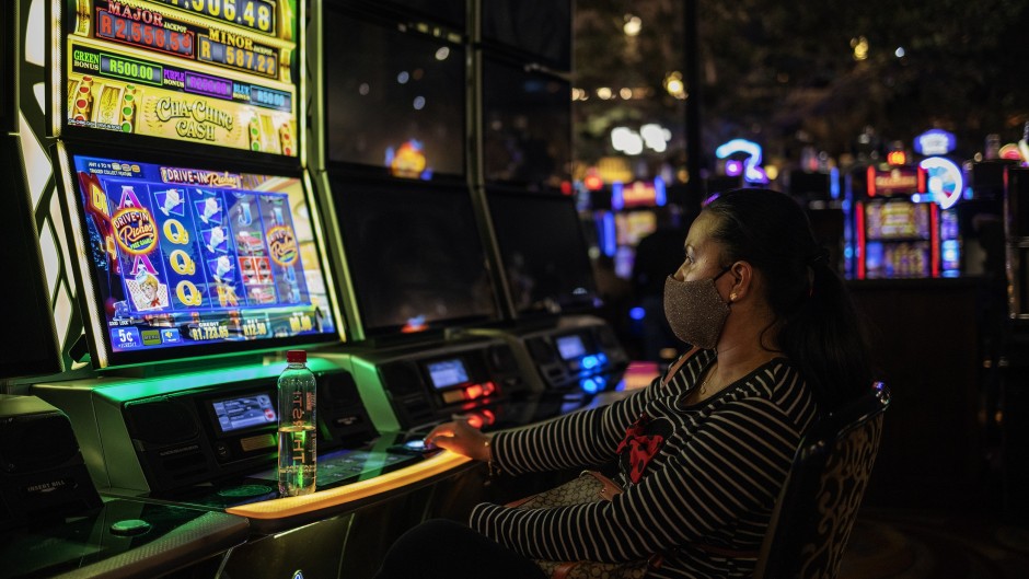 A woman gambles at the Montecasino complex after government allowed casinos, cinemas and restaurants to resume their activity.