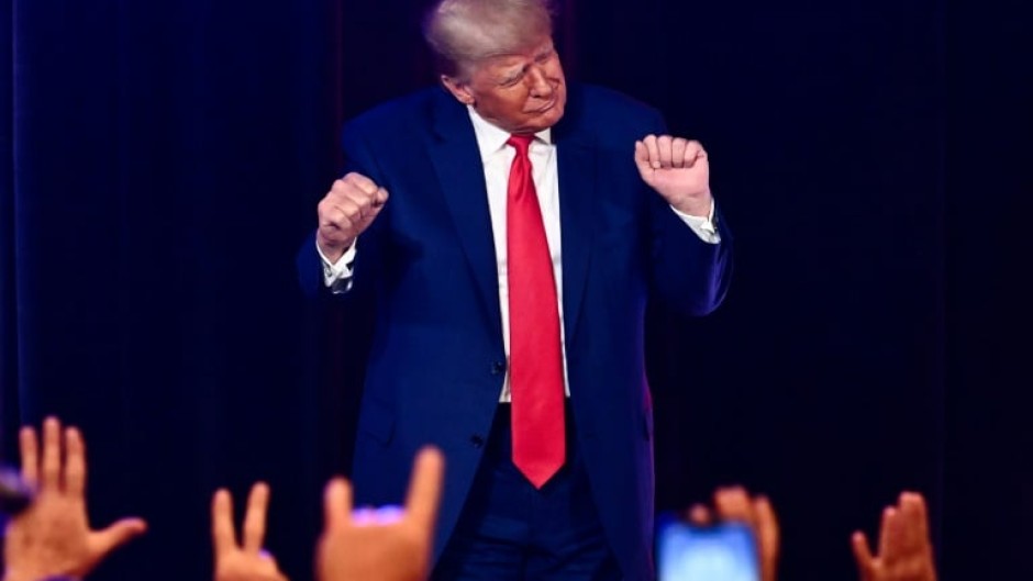 Former US president and 2024 Republican presidential hopeful Donald Trump, pictured dancing at a campaign event, is facing multiple felony charges